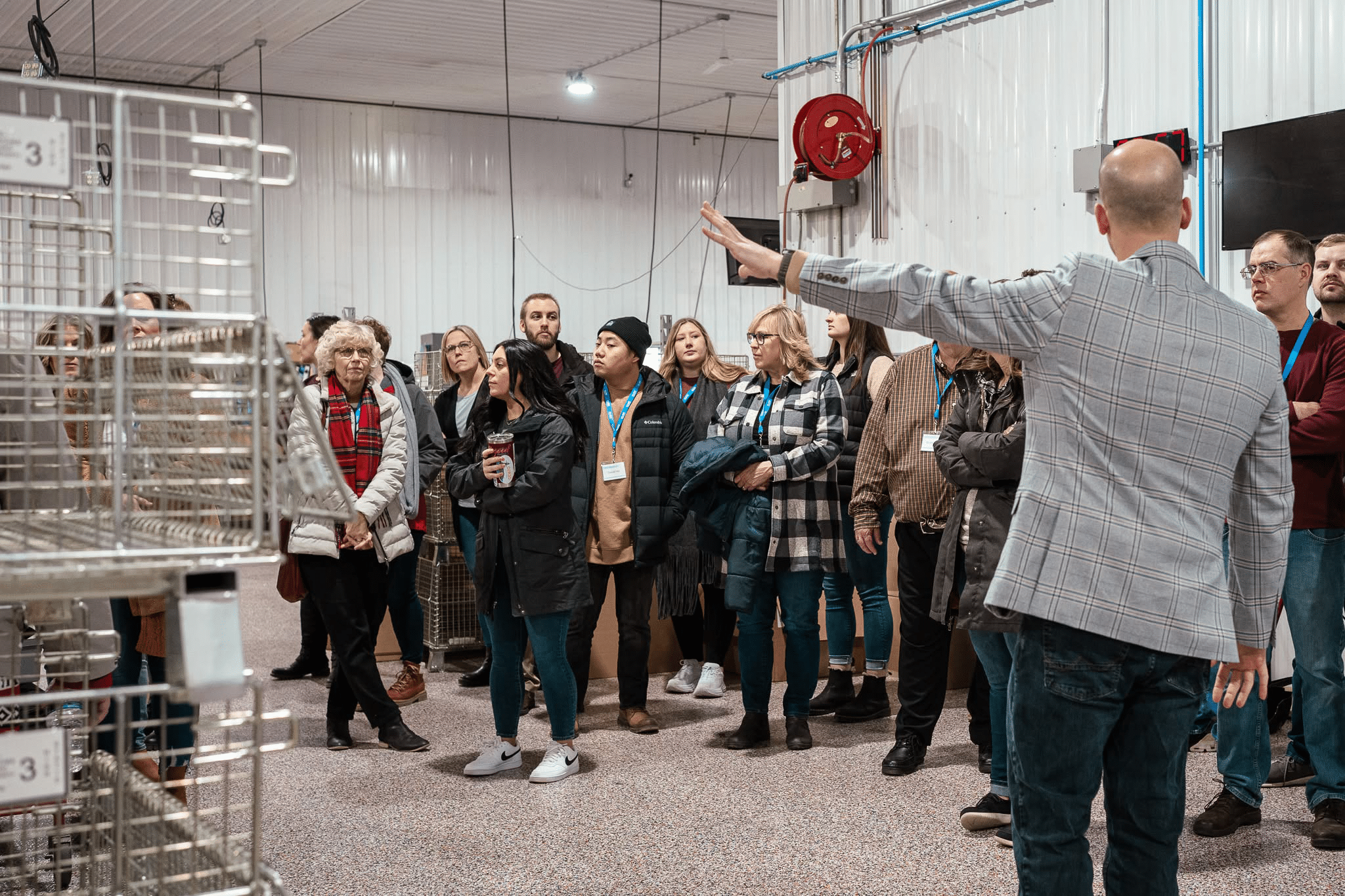 Trainer talking to group of participants in a workshop