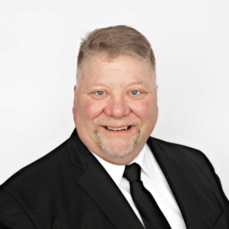 headshot of joel harmoning