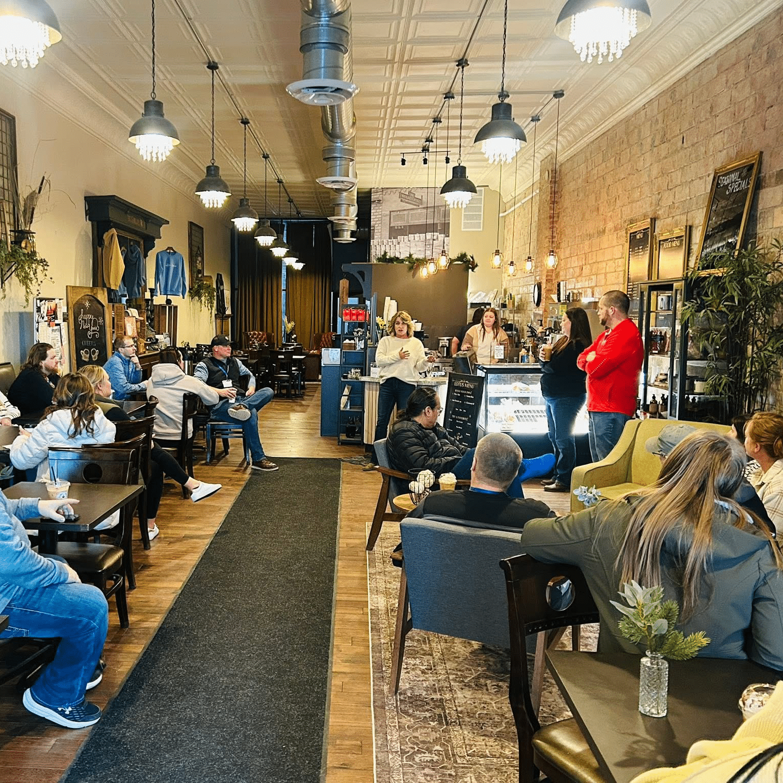 Group of participants in coffee shop square